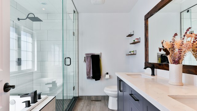 Ceramic tile installation on bathroom wall with uniform grout spacer lines